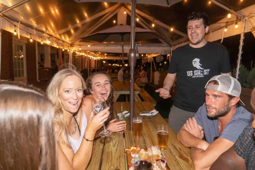 A group enjoy a drink at an outdoor bar